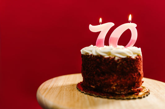 70th birthday party celebration with balloons, banners, and themed tableware and decorations
