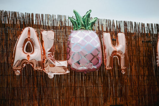 Beach party with tropical decorations, seashell accents, and beach party supplies