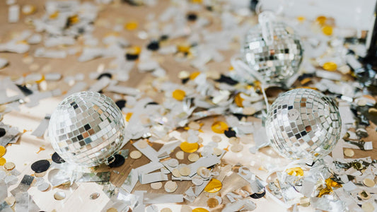 Disco themed party with neon decorations, dance floor, and retro disco party supplies