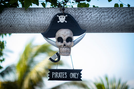 Pirate themed party with treasure decorations, flags, and pirate party supplies