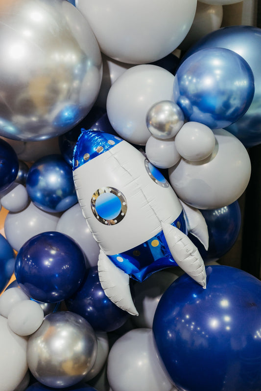 Space themed party with galaxy decorations, planets, and outer space party supplies