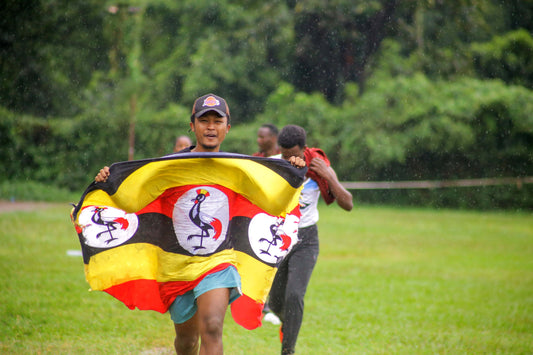 Uganda independence day party with national flag decorations, patriotic tableware, and themed party supplies