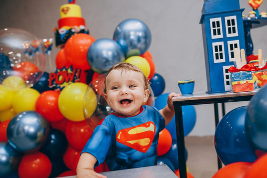 Superhero party with cape decor, comic book accents, and superhero party supplies