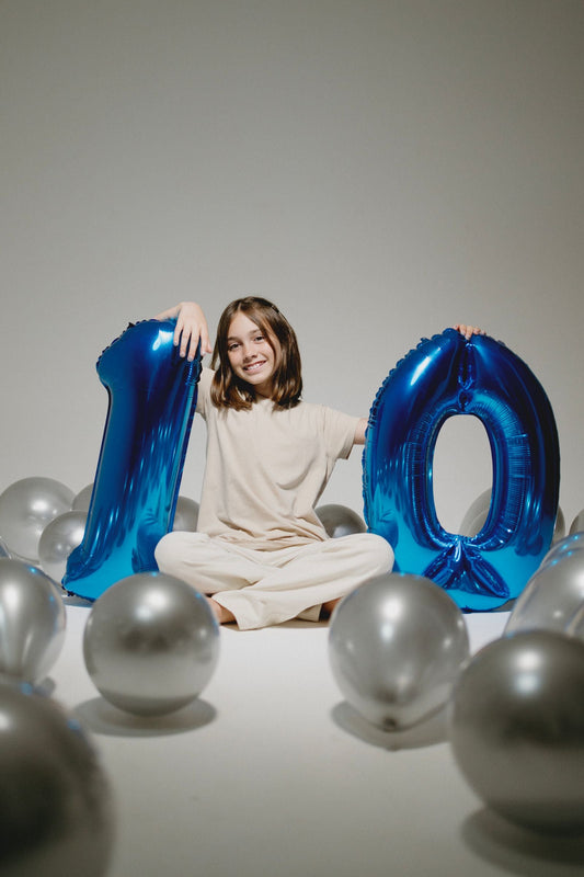 10th birthday party celebration with balloons, banners, and themed tableware and decorations