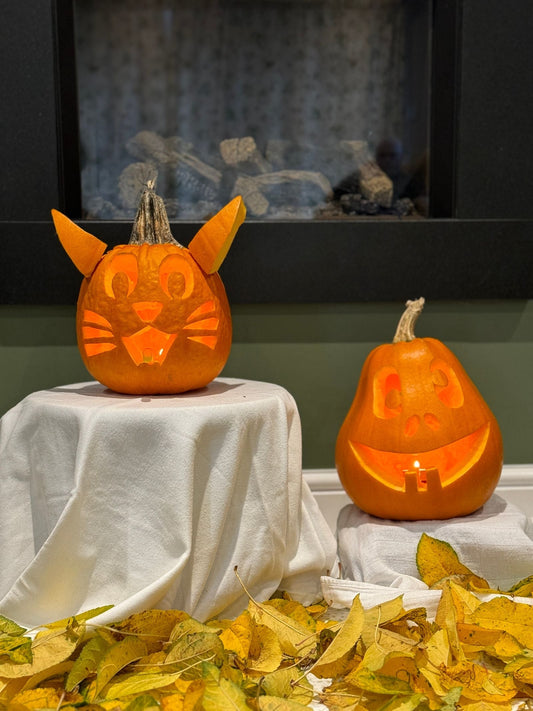 Pumpkin carving party with carved pumpkins, carving tools, and autumn party supplies