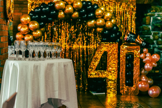 40th birthday party celebration with balloons, banners, and themed tableware and decorations