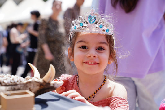 Princess themed birthday party with pink decorations, tiaras, and princess party supplies