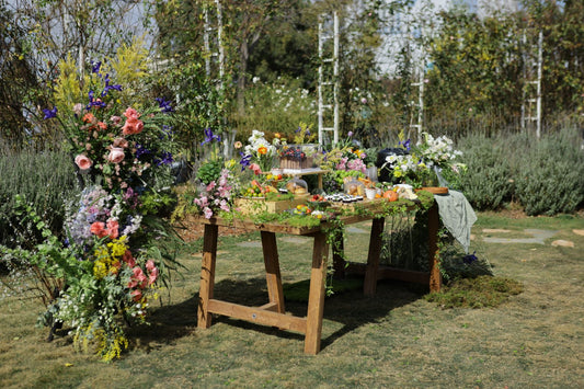 Spring party with fresh floral decor, pastel tableware, and spring party supplies