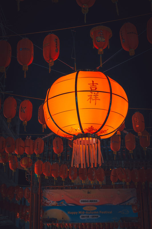 Mid-Autumn Festival party with mooncakes, lanterns, and moon gazing decorations