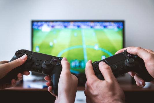 Video game themed party with controller decorations, pixel art, and gaming party supplies