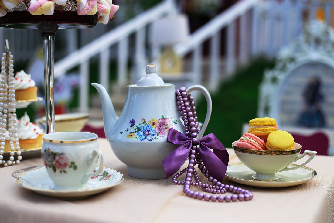 Tea party with vintage table setting, teacups, and elegant tea party decorations