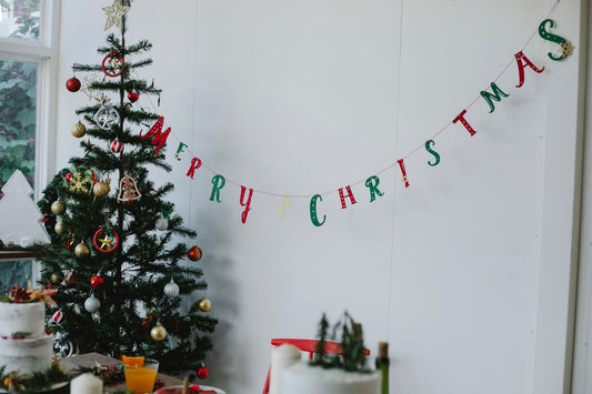 Christmas party table with holiday plates, napkins, and Christmas party supplies