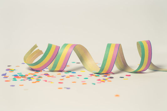 Rainbow themed party with multicolor decorations, balloons, and rainbow party supplies