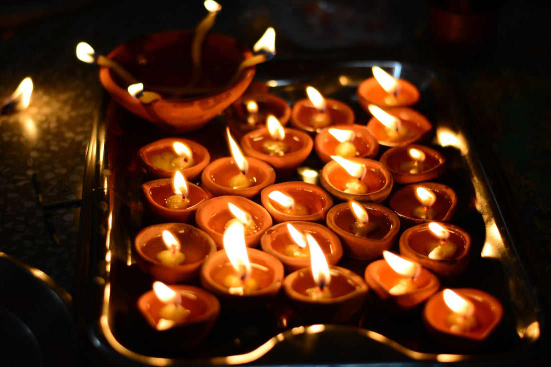 Diwali party with diyas, rangoli decor, and festive Indian party supplies