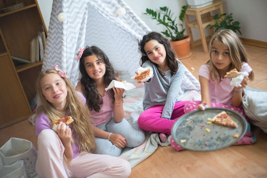 Sleepover party with cozy bedding, pajama decor, and sleepover party supplies