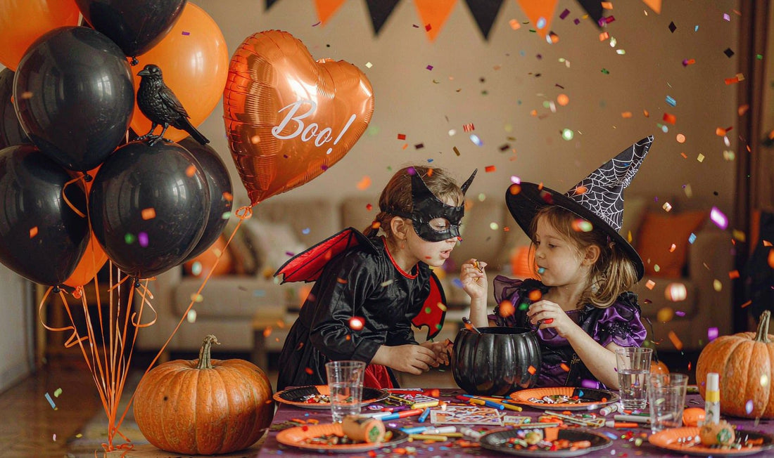 Kids in Halloween costumes playing party games with balloons and pumpkin crafts
