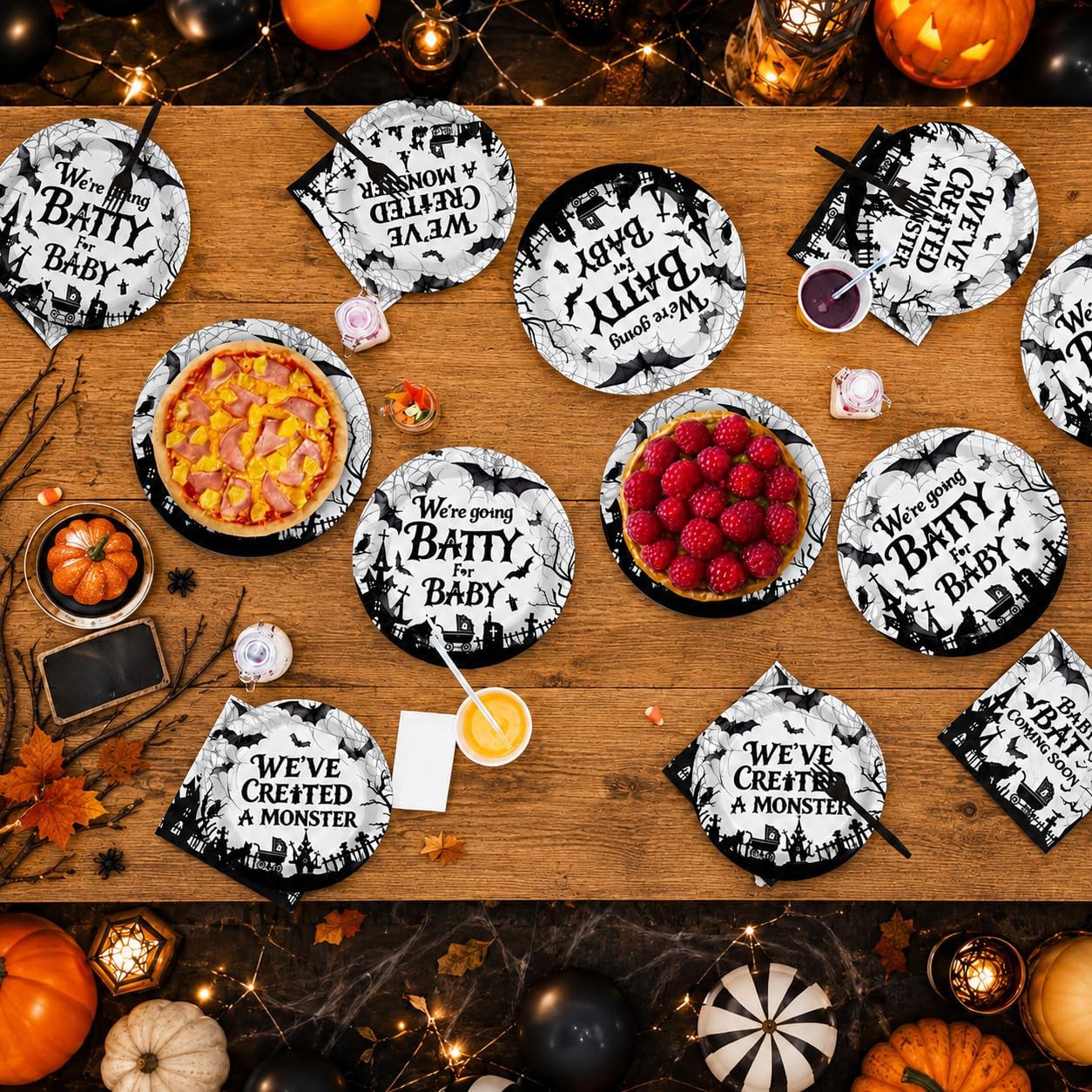 Stack of nine inch Halloween baby shower dinner plates with bat artwork