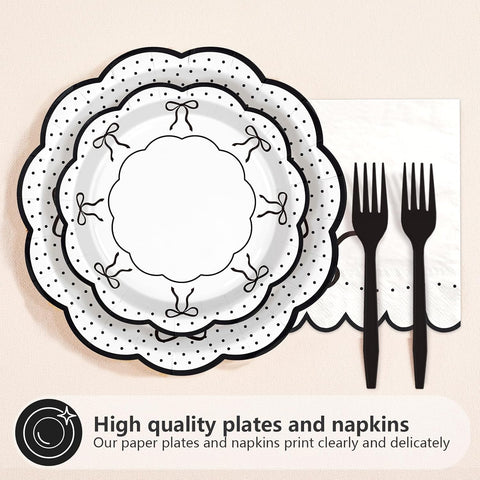Scalloped black bow dinner plate with polka dots and forks
