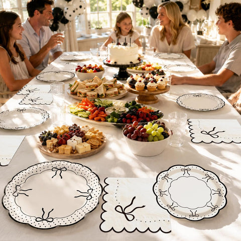 Bridal shower table styled with the black bow plates