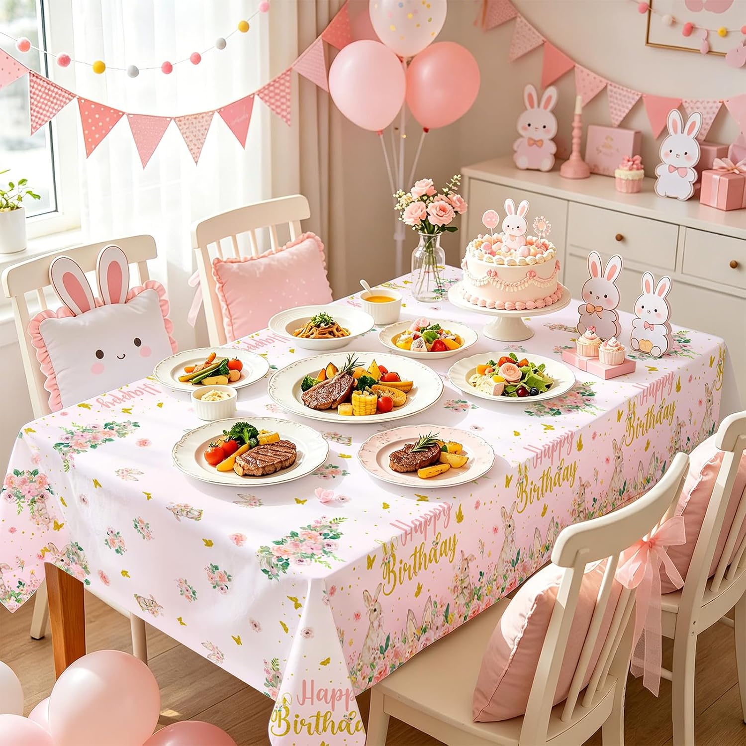Girls birthday party scene with pink bunny themed tablecloth