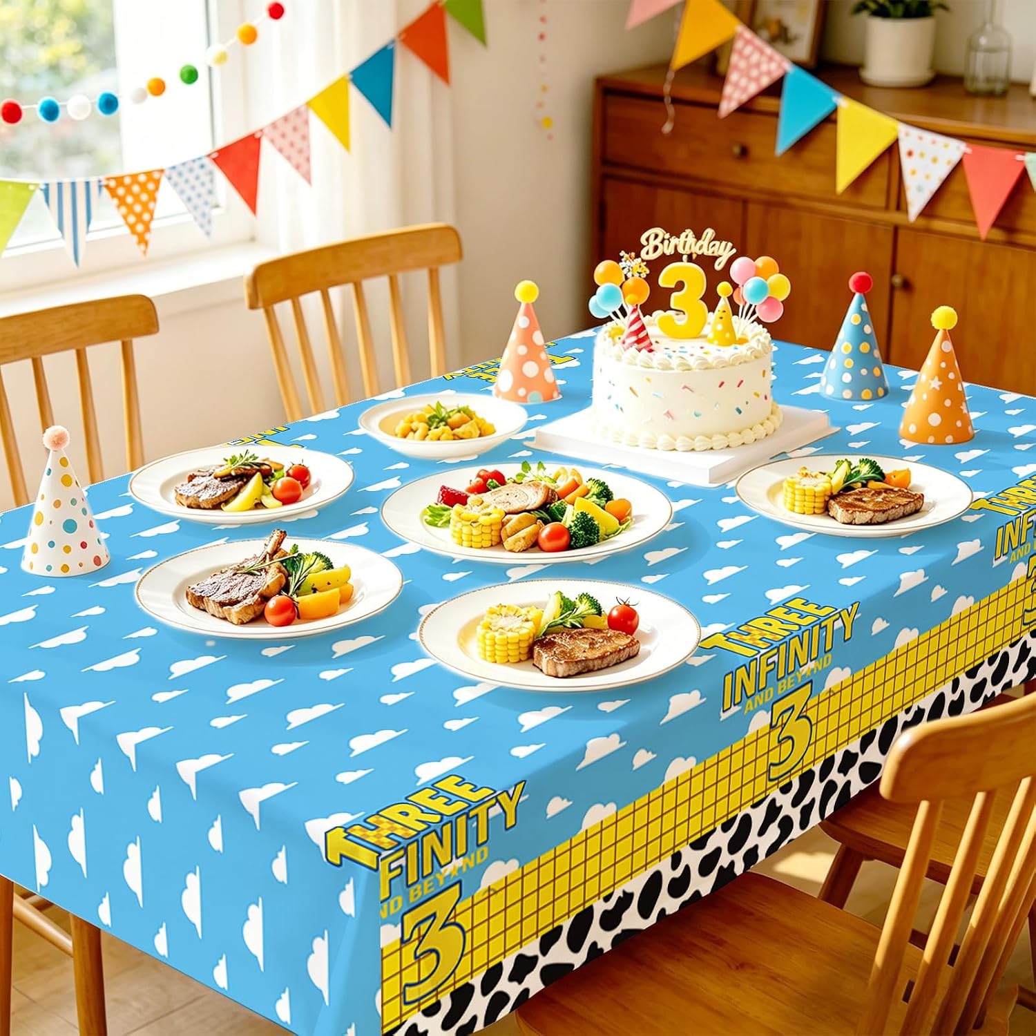 Boys 3rd birthday party scene with cartoon cow themed tablecloth and celebration decorations