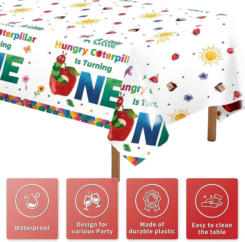 Close-up of hungry caterpillar 1st birthday plastic tablecloth with one year lettering and caterpillar illustration