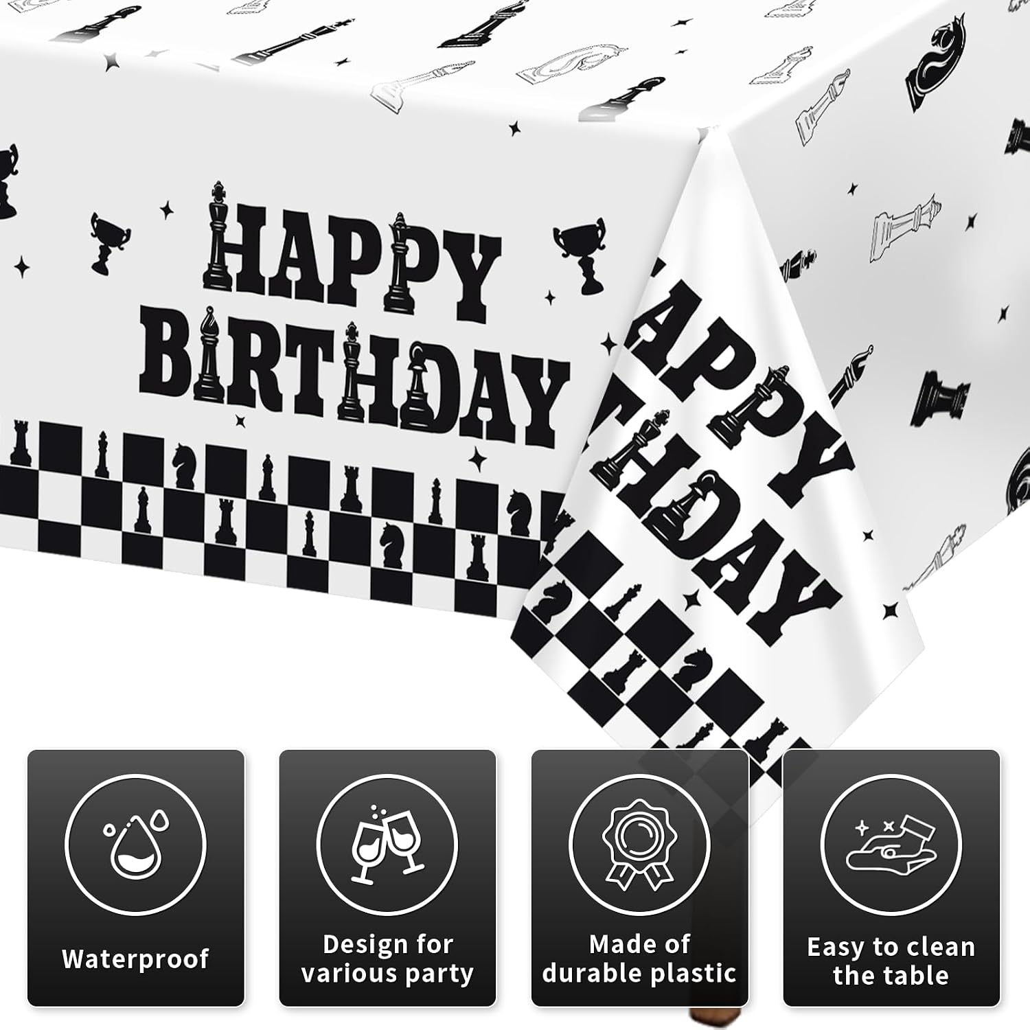 Close-up of chess birthday plastic tablecloth with black and white checkered pattern and chess piece illustrations
