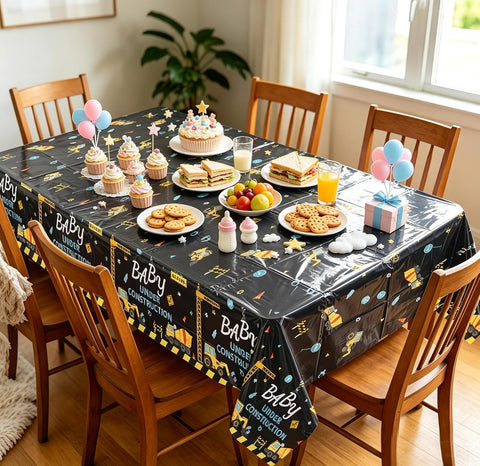 Boy baby shower party scene with construction truck themed tablecloth