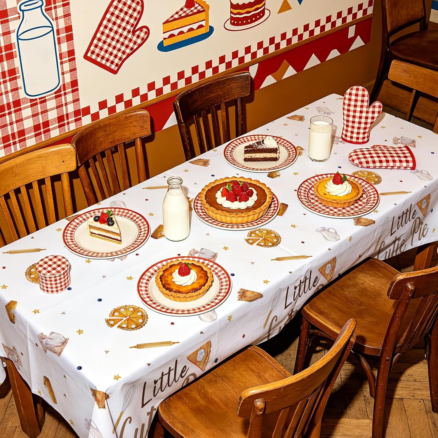 Baby shower party scene with sweet as pie themed tablecloth and pie decorations