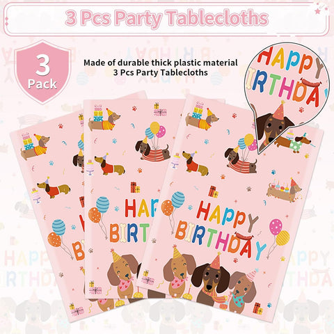 Dachshund birthday tablecloth draped on party table with puppy themed decorations