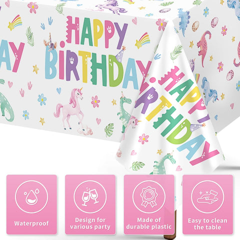 Close-up of rainbow dino unicorn plastic tablecloth with pastel pink background
