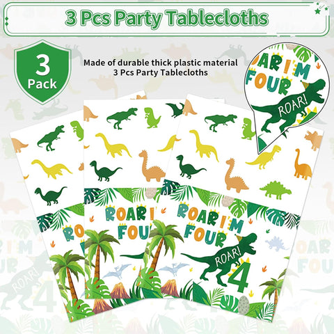 Dinosaur 4th birthday tablecloth draped on party table with dino themed decorations