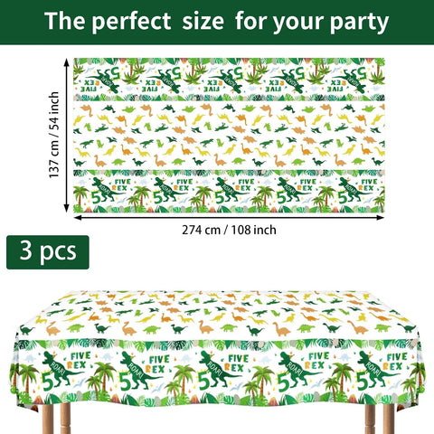 Flat lay of three dinosaur 5th birthday tablecloths with green T-Rex and festive lettering