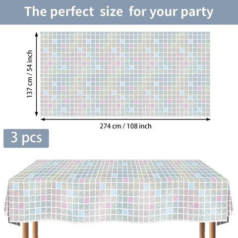 Flat lay of three holographic disco tablecloths showing iridescent pink silver shimmer