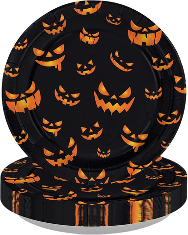 Black Halloween paper plate covered with glowing orange jack o lantern faces