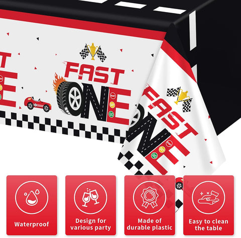 Flat lay of three red race car birthday tablecloths with checkered racing pattern