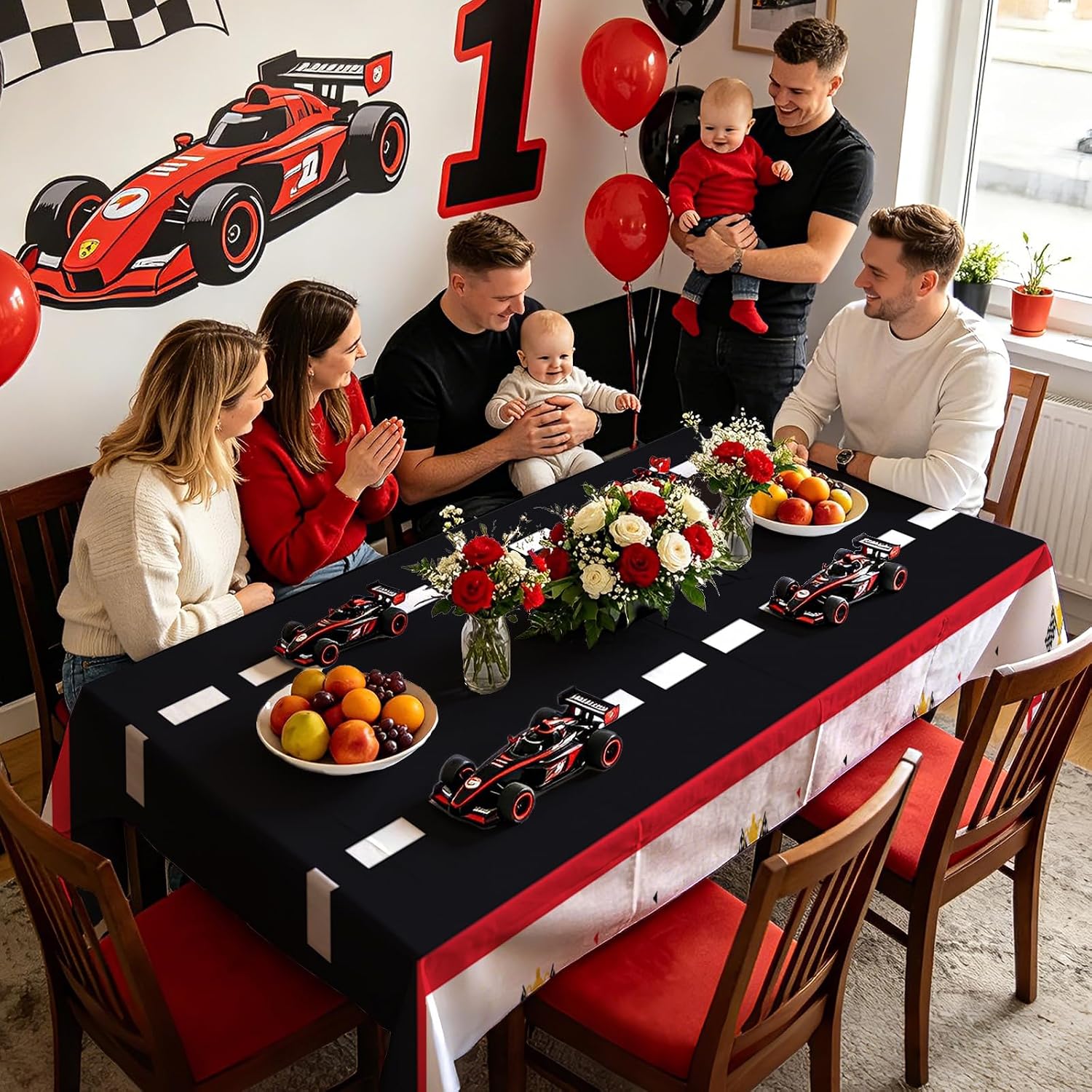 Boys 1st birthday party scene with red race car themed tablecloth