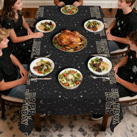 Kids boys space movie birthday party scene with galaxy tablecloth