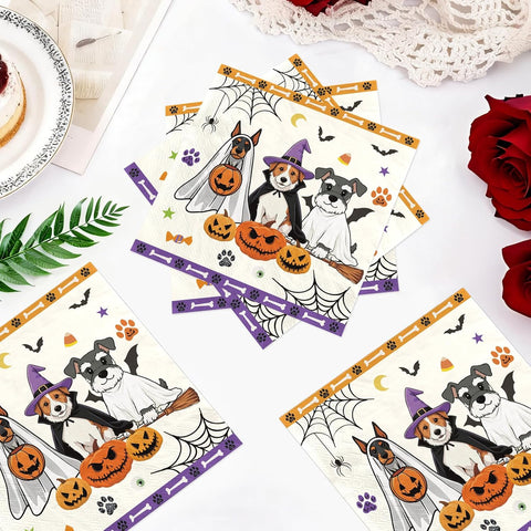 Flat lay of the Halloween ghost dog napkins and costumed dogs
