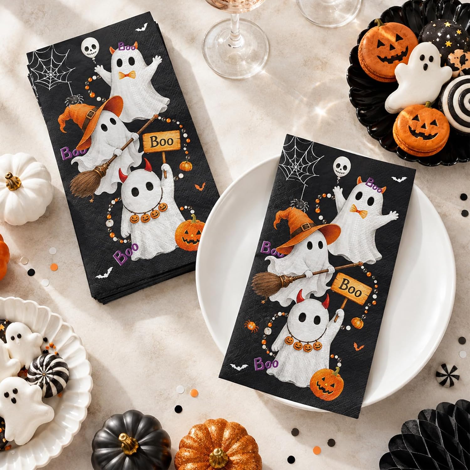 Black Halloween ghost napkins styled on a dinner plate