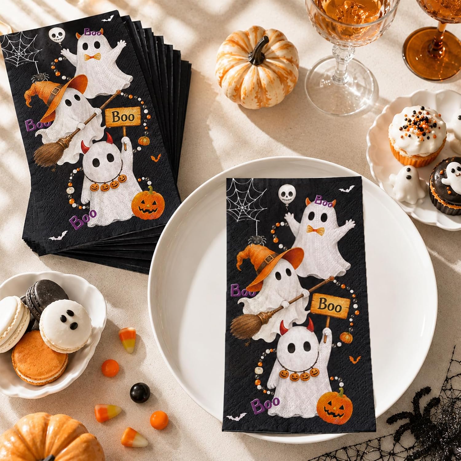 Halloween ghost napkin on a plate with pumpkins