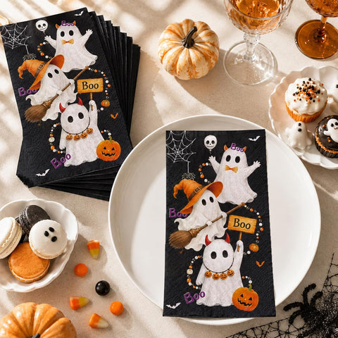 Halloween ghost napkin on a plate with pumpkins