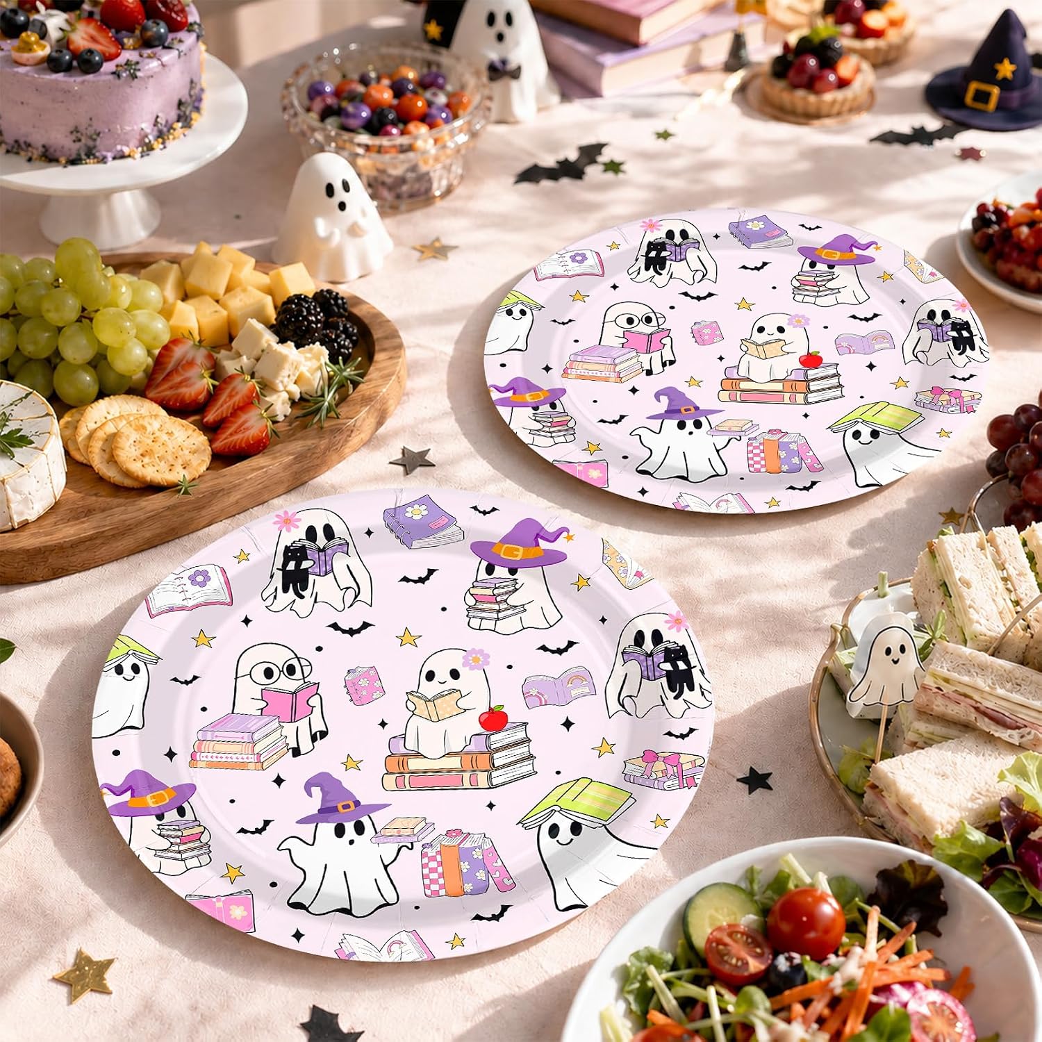 Party table styled with the ghost reading book paper plates