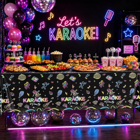 Black light glow party scene with neon themed tablecloth and decorations
