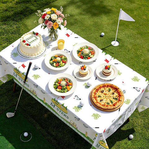Boys first golf birthday party scene with sports themed tablecloth
