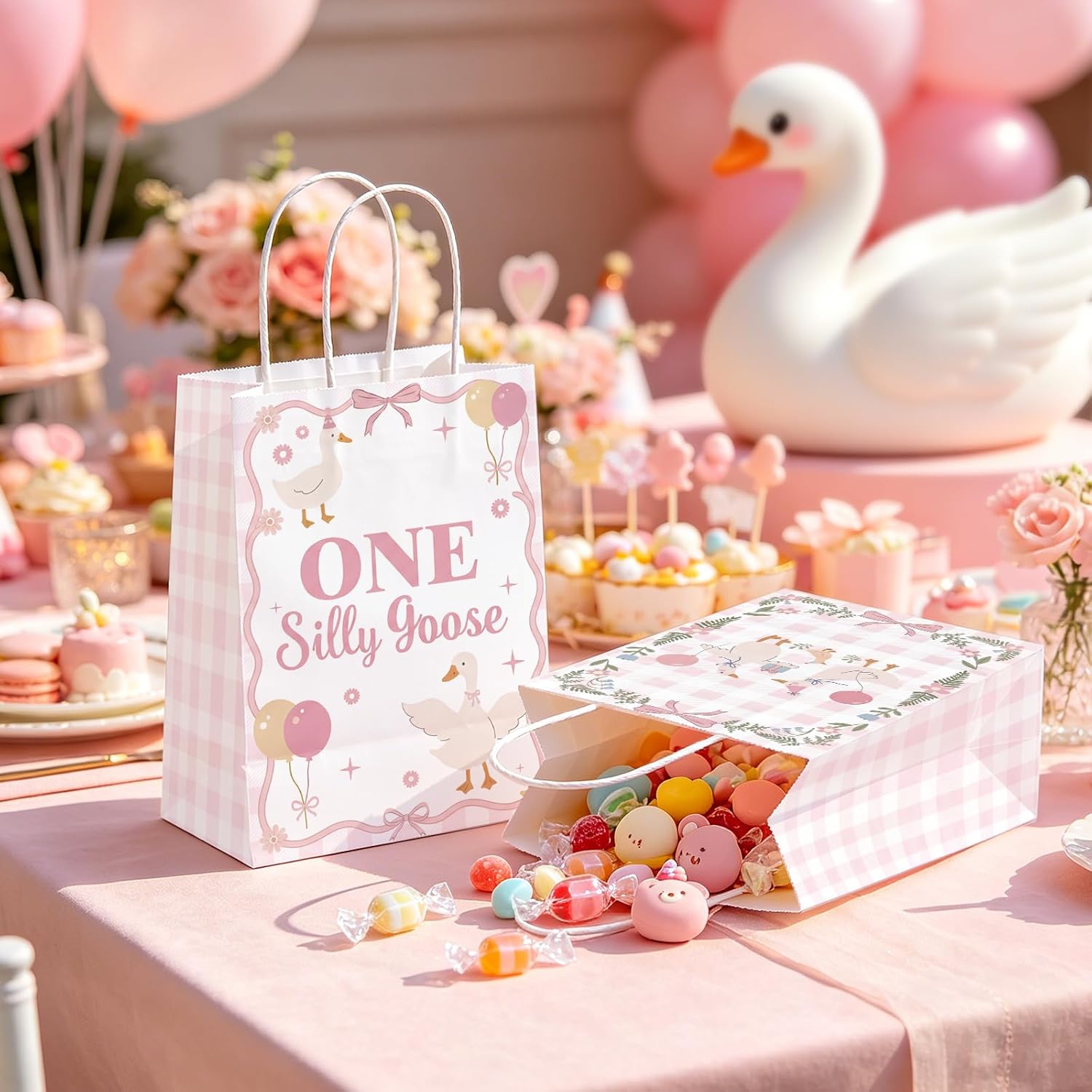 Lifestyle shot of pink silly goose goodie bags filled with treats