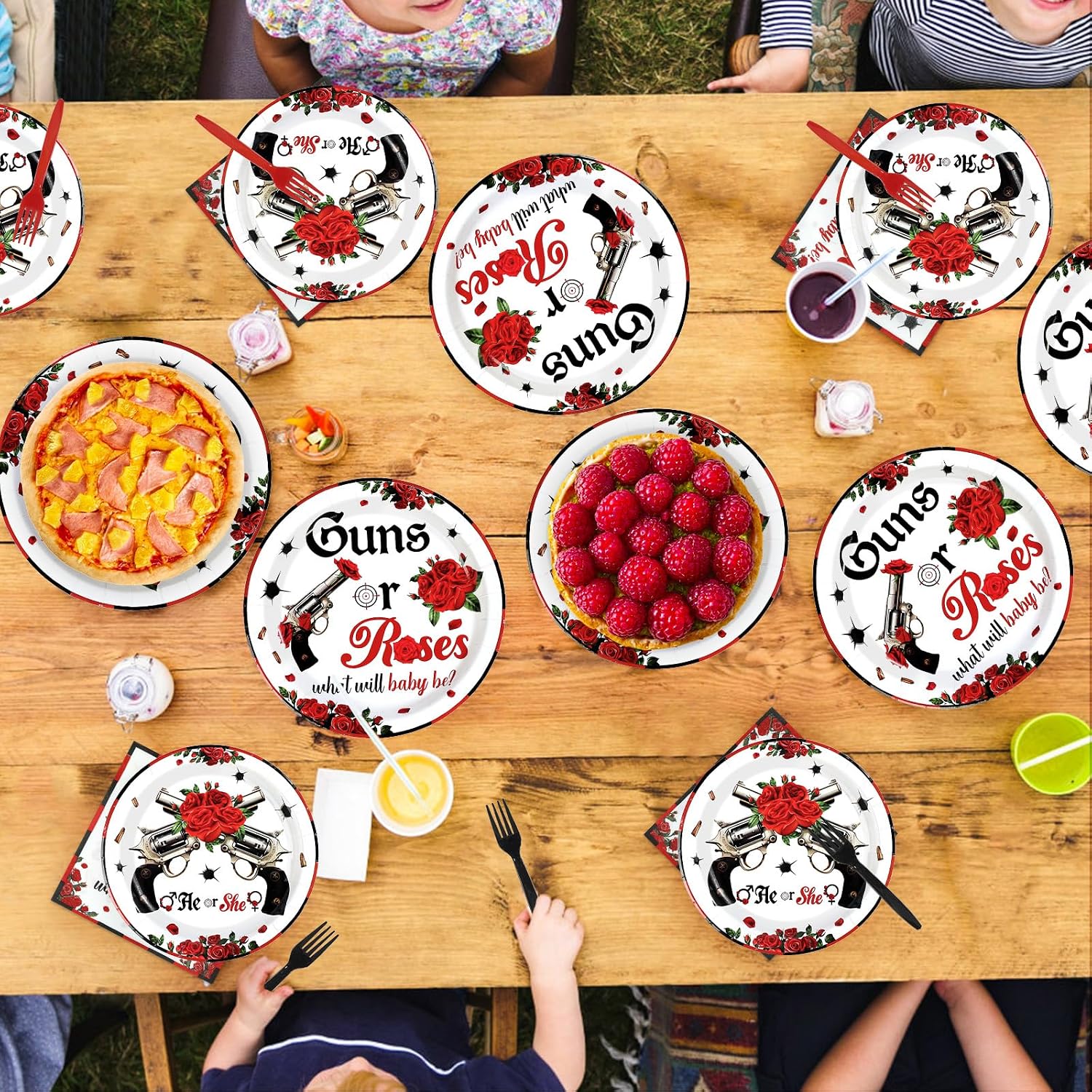 Gender reveal party table styled with the red and black tableware
