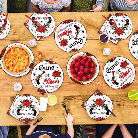 Gender reveal party table styled with the red and black tableware