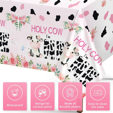 Close-up of 1st birthday plastic tablecloth with Holy Cow I'm One lettering