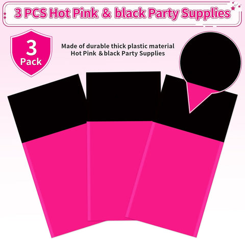Hot pink tablecloth draped on party table with black themed decorations